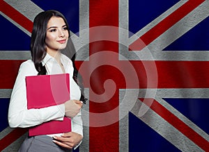 Optimistic woman with United Kingdom flag. Distance learning in Great Britain