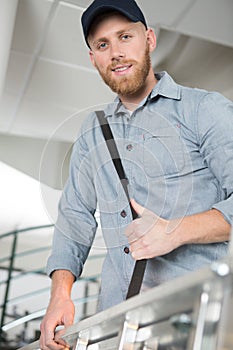 optimistic worker smiling at camera