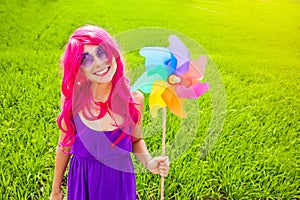 Optimistic young woman wearing pink wig