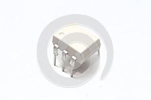 An optocoupler or opto-isolator electronic component on white background