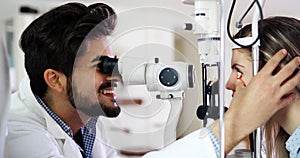 Optometrist checking patient eyesight and vision correction