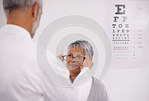 Optometrist doctor, elderly patient and glasses for vision, eye exam in medical consultation at optometry practice