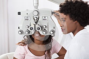 Optometrist Doing Sight Testing For Patient