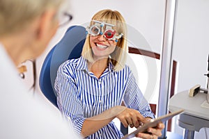 Optometrist examining patient in modern ophthalmology clinic