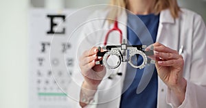 Optometrist holds lens selection frame in clinic