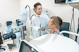 Optometrist talking with a patient in the clinic