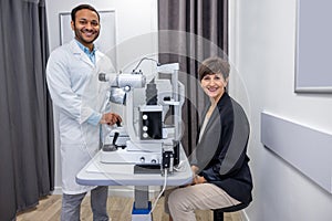 Optometrist in white scubs near refractometer