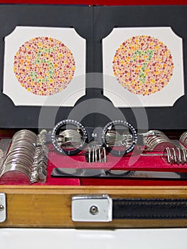 Optometry lens, eyeglasses and color blind test