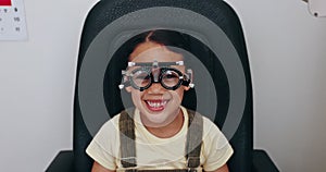 Optometry, optician and portrait of child with frame for testing vision, sight and glasses for eyes. Healthcare, medical