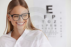 Optometry And Vision. Smiling Girl At Ophthalmologist Office