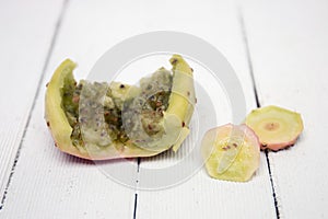 Opuntia ficus-indica cactus fruit opened on a white background