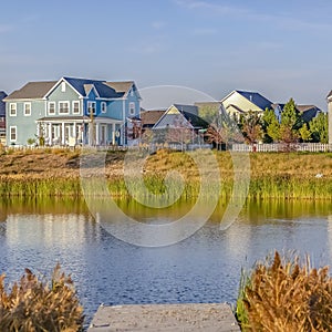 Oquirrh Lake with a wooden deck and lovely homes