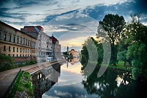 Oradea City Town Hall on Crisul Repede River, Romanian, golden hour.