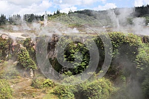 Orakei Korako hidden geothermal valley: View on steaming hills Fumaroles