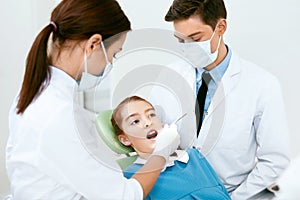 Oral Health Care. Dentist Doctors Making Examination Procedure