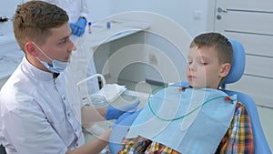 Oral teeth checkup and preventive examination in dentistry for child boy.