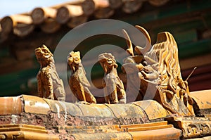 Oranate ceramic figures on the roof of the Forbidden City, Beijing