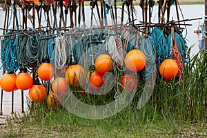Orang buoys with a turquoise fishing net