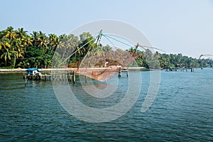 Orang Chinese fisher net along the kollam kottapuram waterway photo