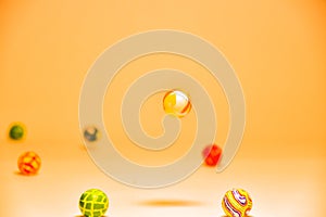 Orange abstract background with bouncy balls and space for text