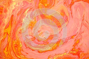 Orange abstract marble background, stains of red and yellow paint on the surface of the water. Liquid colorful backdrop.