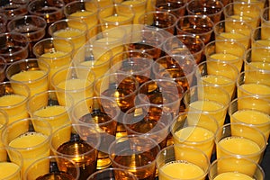 Orange and Apple juice drinks in plastic beakers