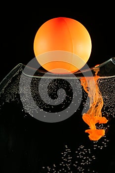 Orange ball and dissolving ink