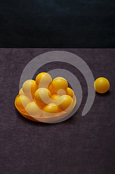 Orange balls in a plate on the table