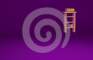 Orange Bathroom rack with shelves for towels icon isolated on purple background. Furniture object for bath room interior