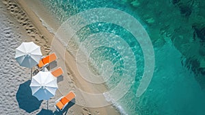 Orange beach umbrella on sandy coast near sea, top view