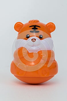 An orange bear toy for children of the house photo