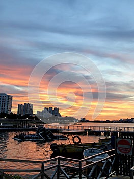 Orange beautiful sunset view and paradise town sun over and blue clouds sky background