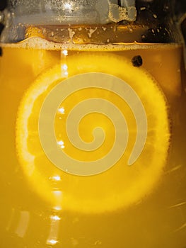 a orange is being poured into a glass