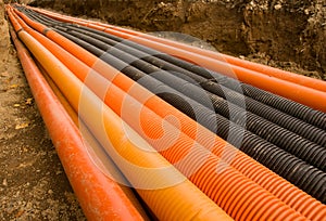 Orange and black plastic pipes