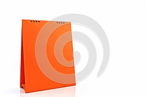 Orange blank paper desk spiral calendar.