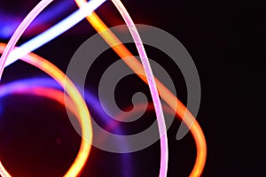 Orange and blue light wire, a light guide wire with different light transmission, light spectrum, and light effects located in a c