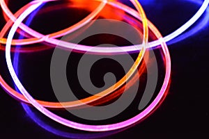 Orange and blue light wire, a light guide wire with different light transmission, light spectrum, and light effects located in a c