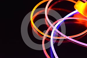 Orange and blue light wire, a light guide wire with different light transmission, light spectrum, and light effects located in a c