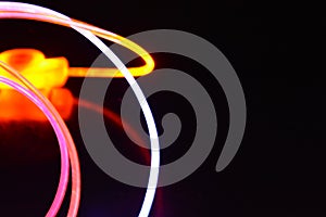 Orange and blue light wire, a light guide wire with different light transmission, light spectrum, and light effects located in a c