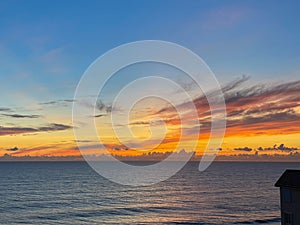 An orange and blue sunrise over the Atlantic Ocean