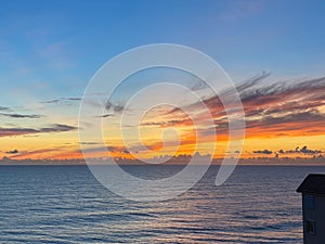 An orange and blue sunrise over the Atlantic Ocean