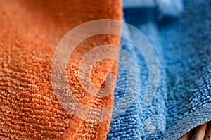 Orange and blue towel close-up, macro shot. The villi of the fabric