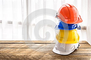 Orange, blue, yellow, white hard safety helmet construction hat