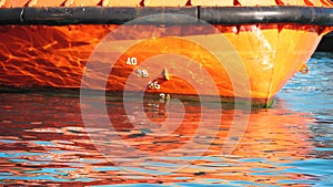 Orange boats draught Slow motion