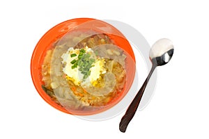 Orange bowl of soup with cabbage