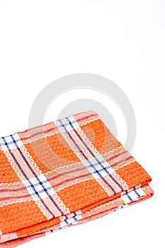 Orange brand new kitchen dishtowel over white background