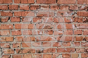 Orange brick wall background texture. Broken bricks.