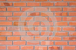 Orange brick wall texture background. Brickwork or stonework flo
