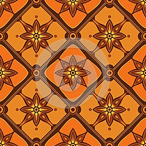 An orange and brown pattern with symmetrical starshaped flowers photo