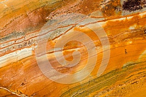 Orange, Brown, and White Polished Granite photo